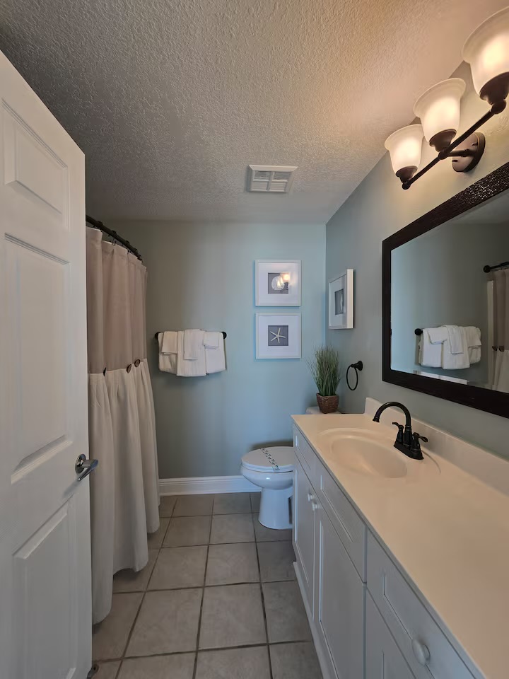 Clean, modern bathroom with beach-themed decor