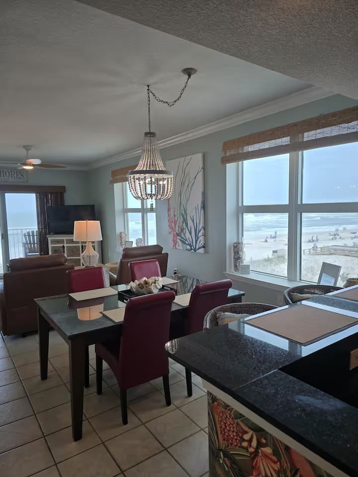 Dining area with beautiful chandelier and ocean views