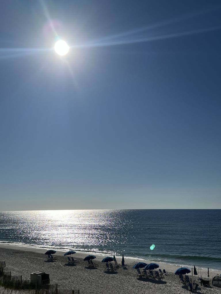 Sunny day at Gulf Shores beach with umbrellas