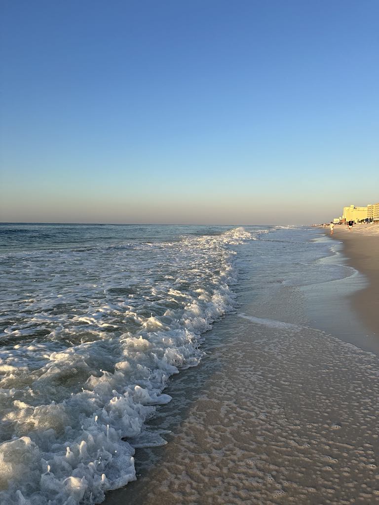 Waves washing onto the white sand beach
