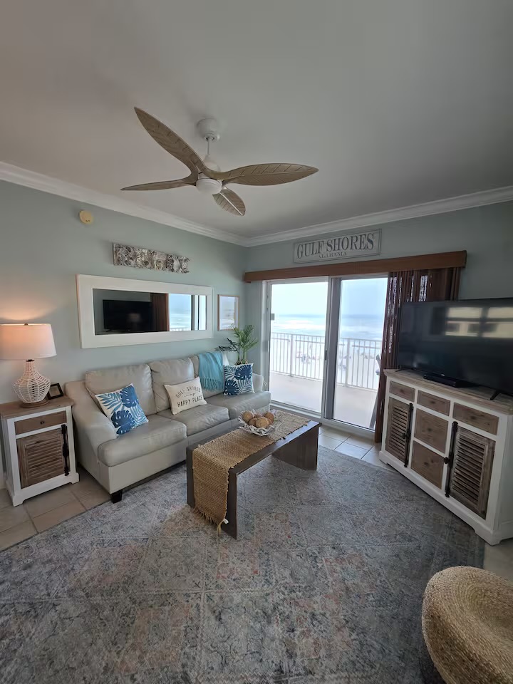 Cozy living room with ocean views through sliding glass doors